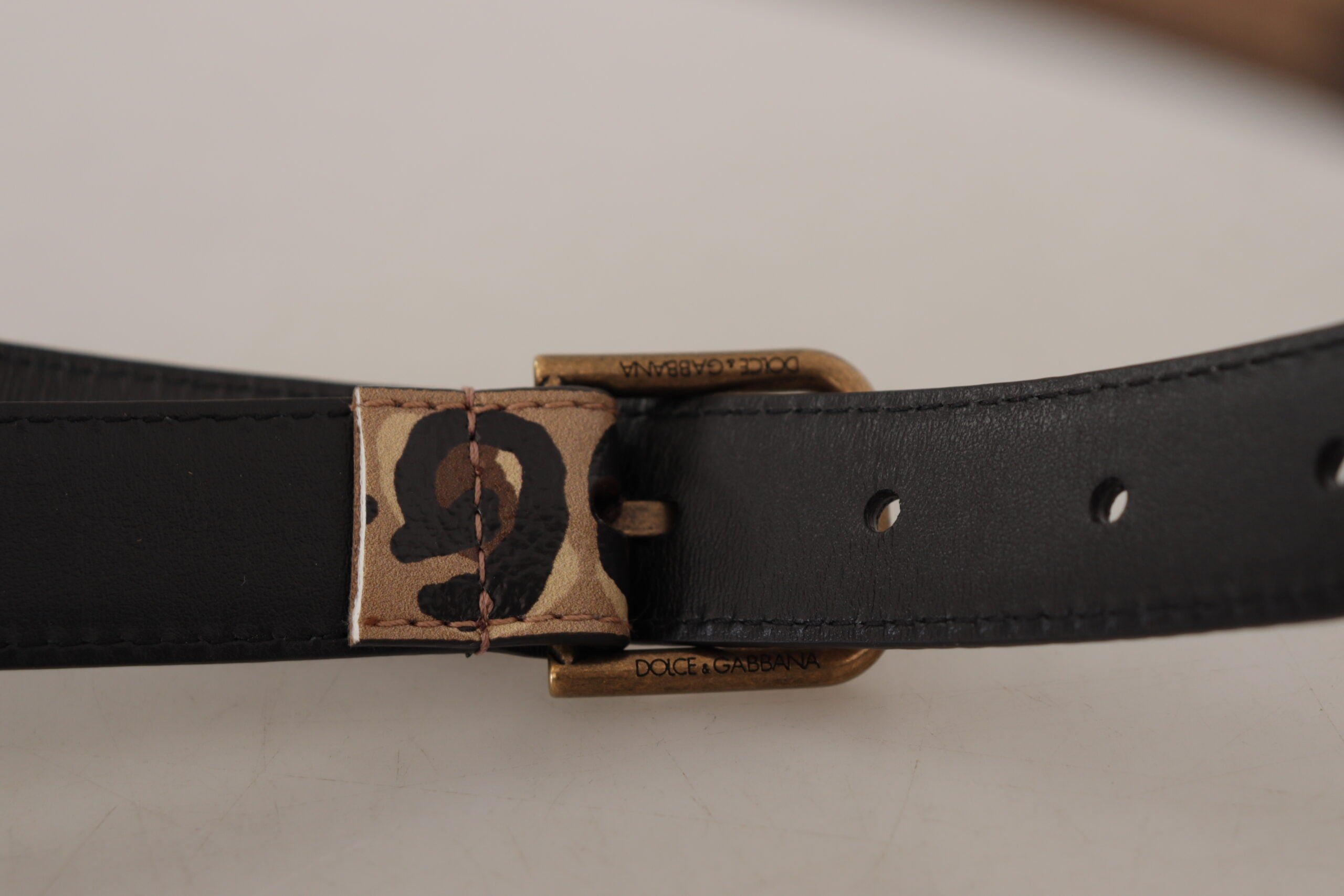 Brown leopard print vintage metal waist belt with buckle from Dolce & Gabbana, featuring bold animal print design.
