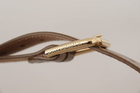 Bronze calf leather waist belt with gold logo buckle from Dolce & Gabbana, featuring a sleek, stylish design.
