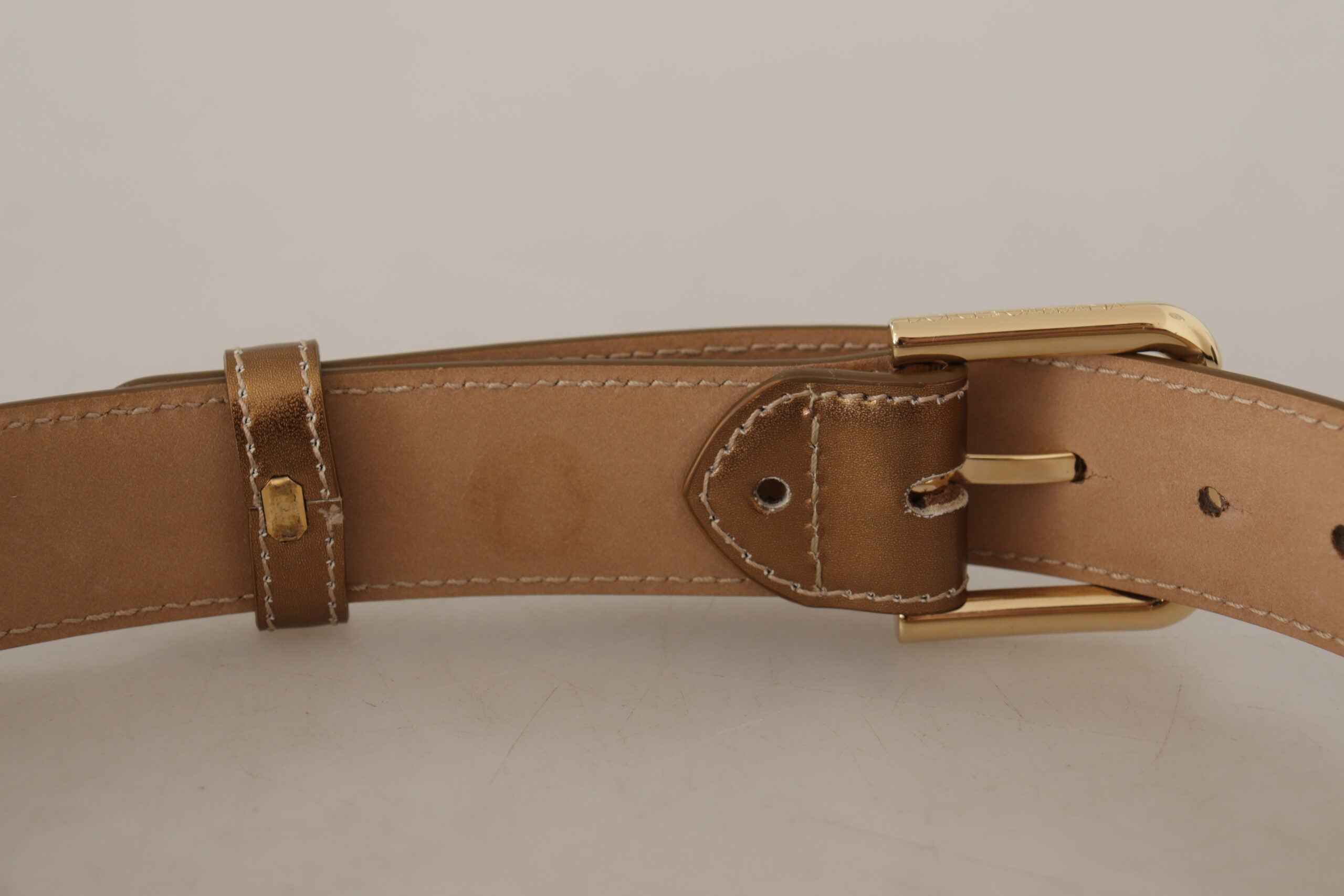 Bronze calf leather waist belt with gold logo buckle from Dolce & Gabbana, featuring a sleek and stylish design.
