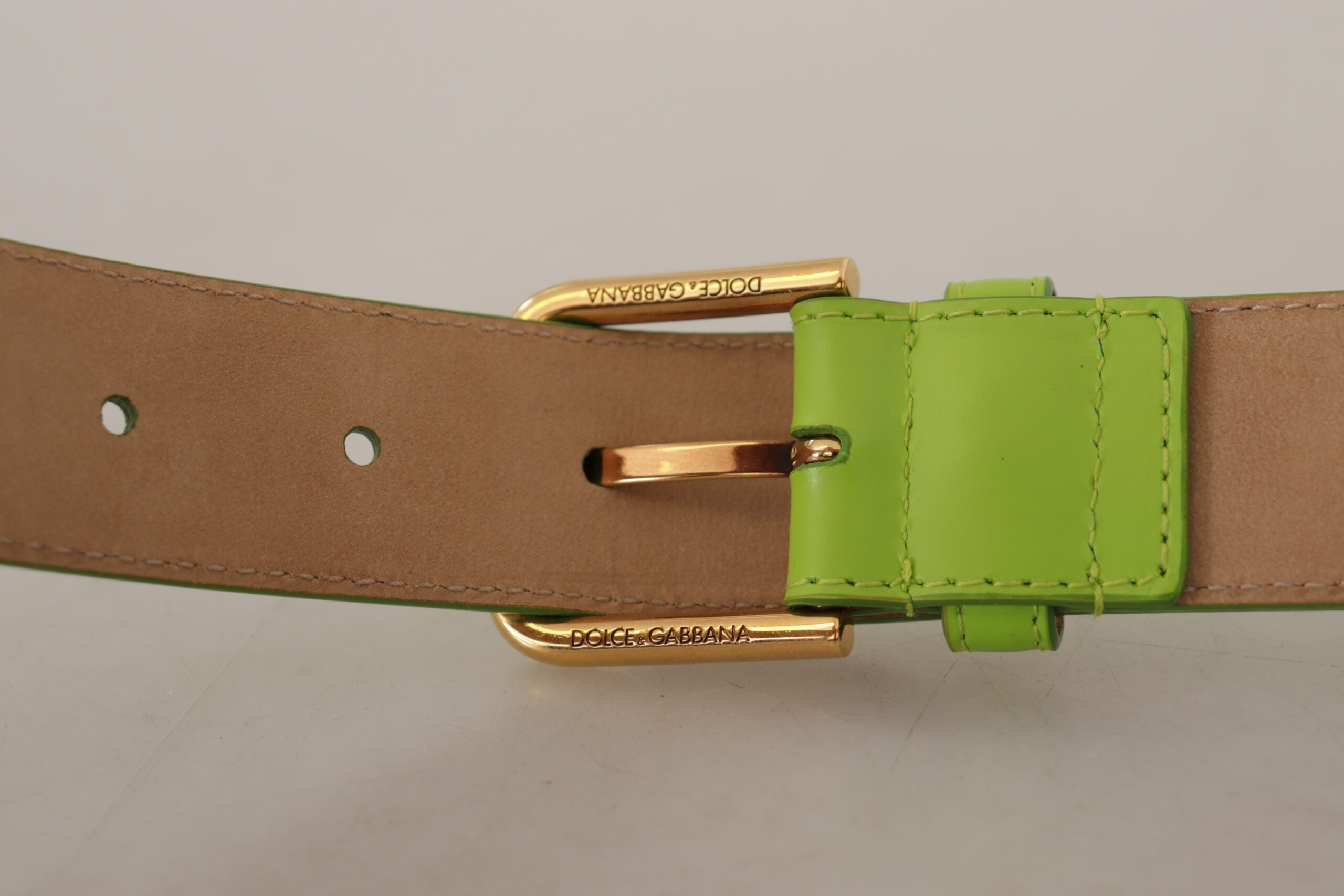 Green leather Devotion Heart micro bag with headphones and belt from Dolce & Gabbana, featuring a compact design and heart-shaped details.