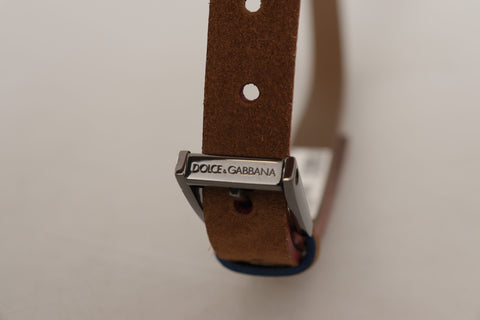 Brown leather belt with engraved metal waist buckle featuring Dolce & Gabbana logo, stylish accessory for men.