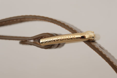 Bronze leather waist belt with gold logo engraved buckle, stylish and luxurious Dolce & Gabbana accessory.