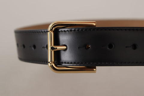 Black solid leather waist belt with gold buckle from Dolce & Gabbana, featuring a classic design and smooth finish.