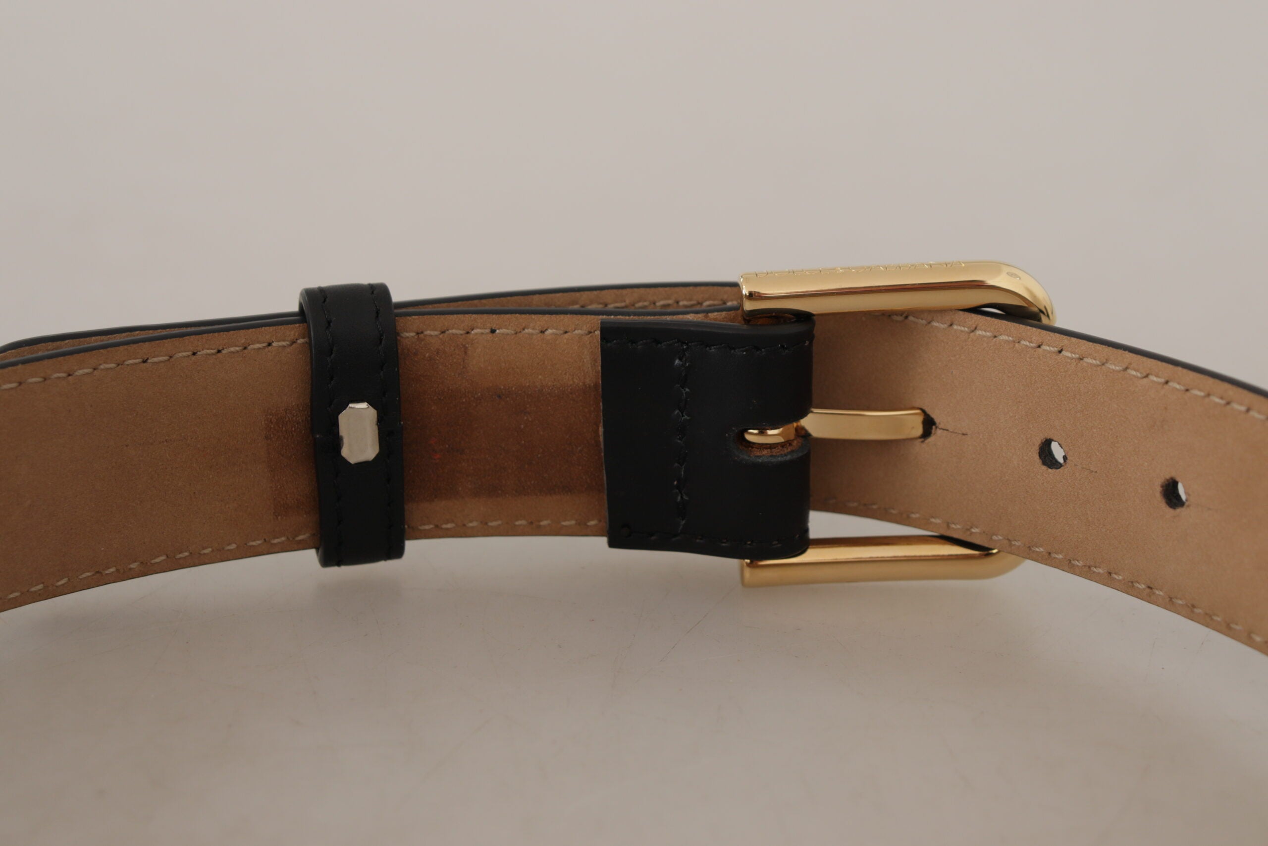 Black solid leather waist belt with gold buckle from Dolce & Gabbana, featuring a classic design and sleek finish.