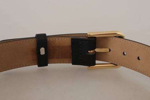 Black solid leather waist belt with gold buckle from Dolce & Gabbana, featuring a classic design and sleek finish.