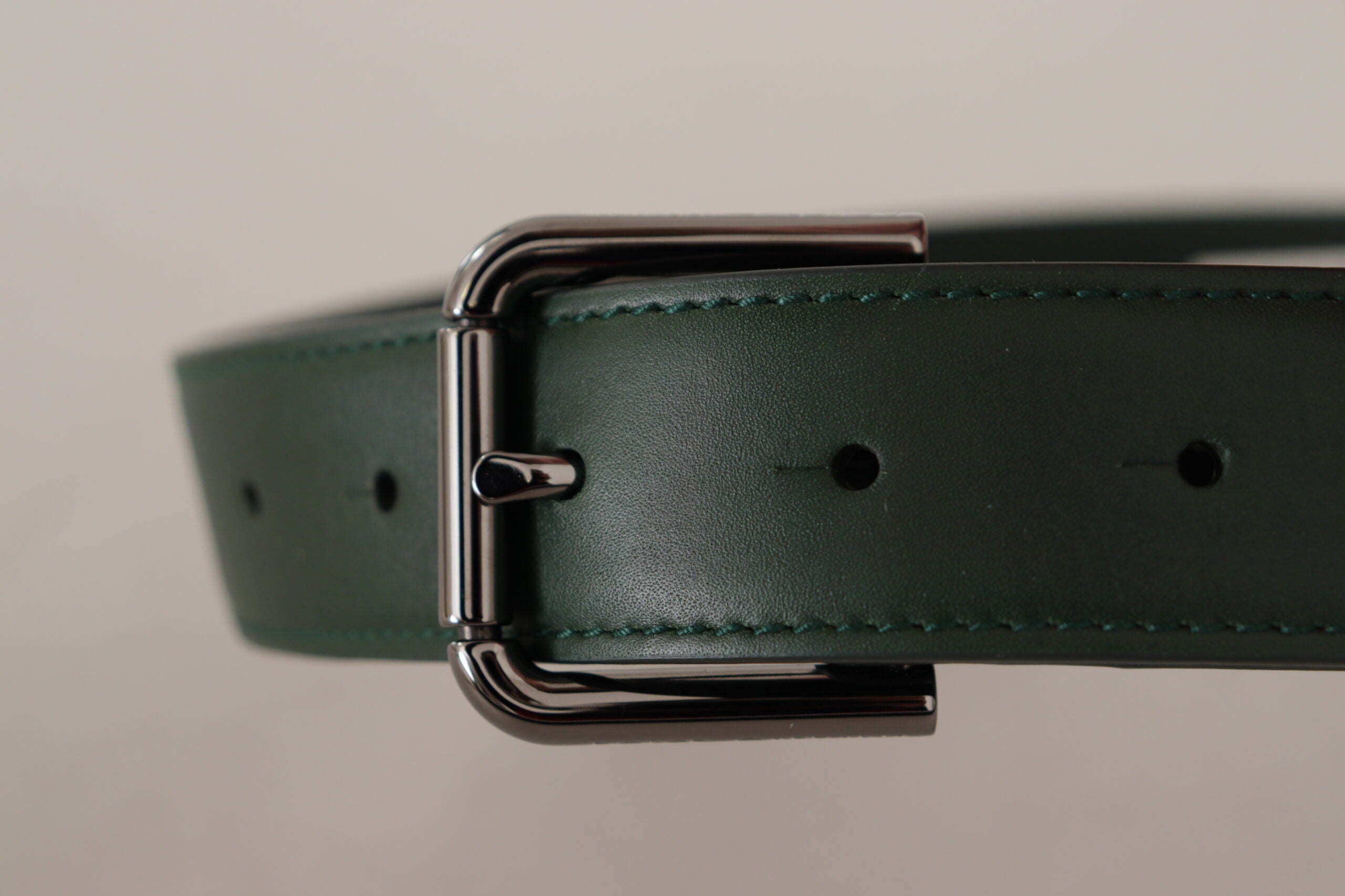 Dolce & Gabbana army green leather waist belt with metal logo buckle and adjustable strap.