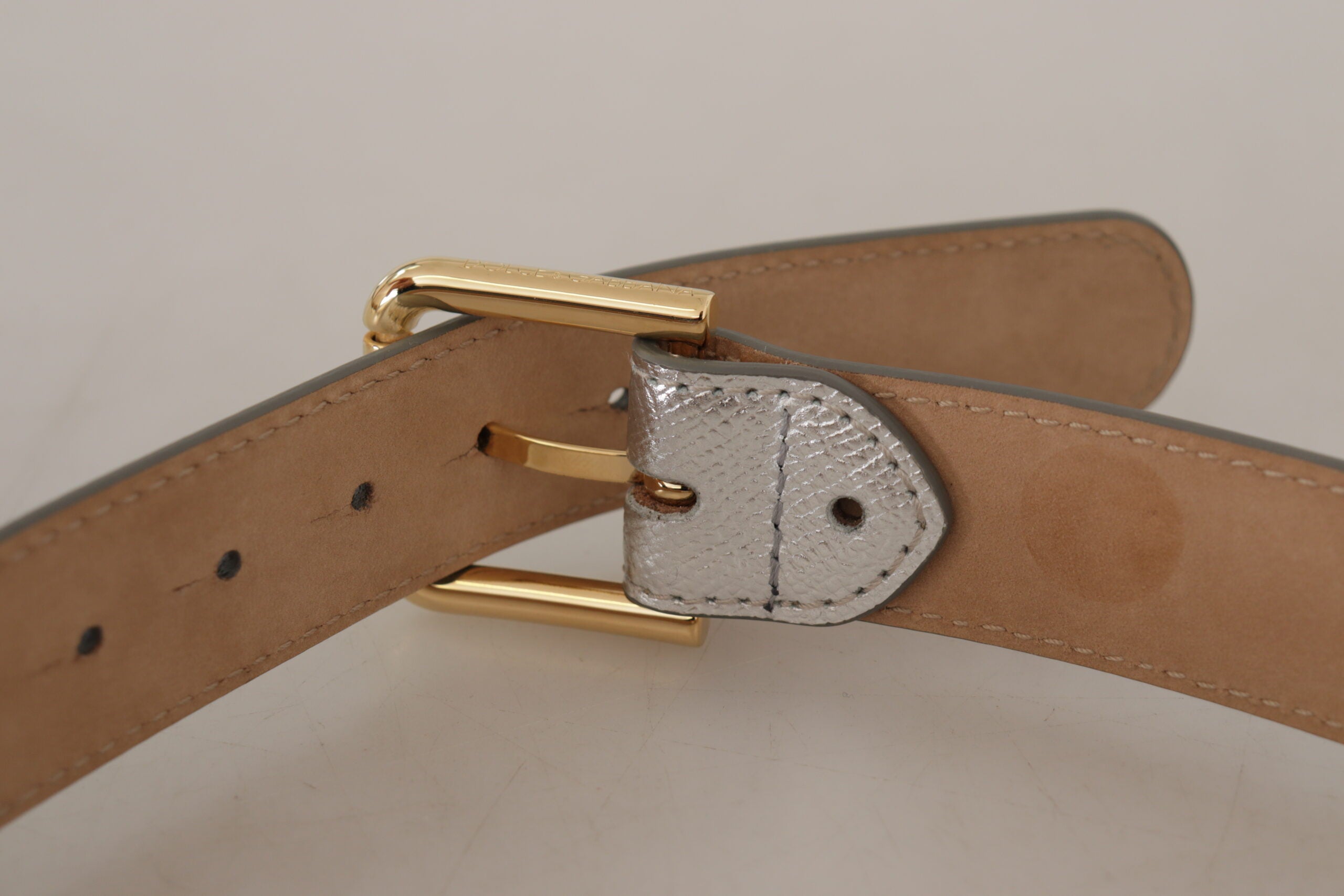 Silver leather belt with gold-tone logo metal buckle from Dolce & Gabbana, featuring a sleek and stylish design.