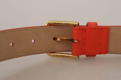Orange leather devotion heart micro bag with headphone and belt details by Dolce & Gabbana, featuring a compact, stylish design.