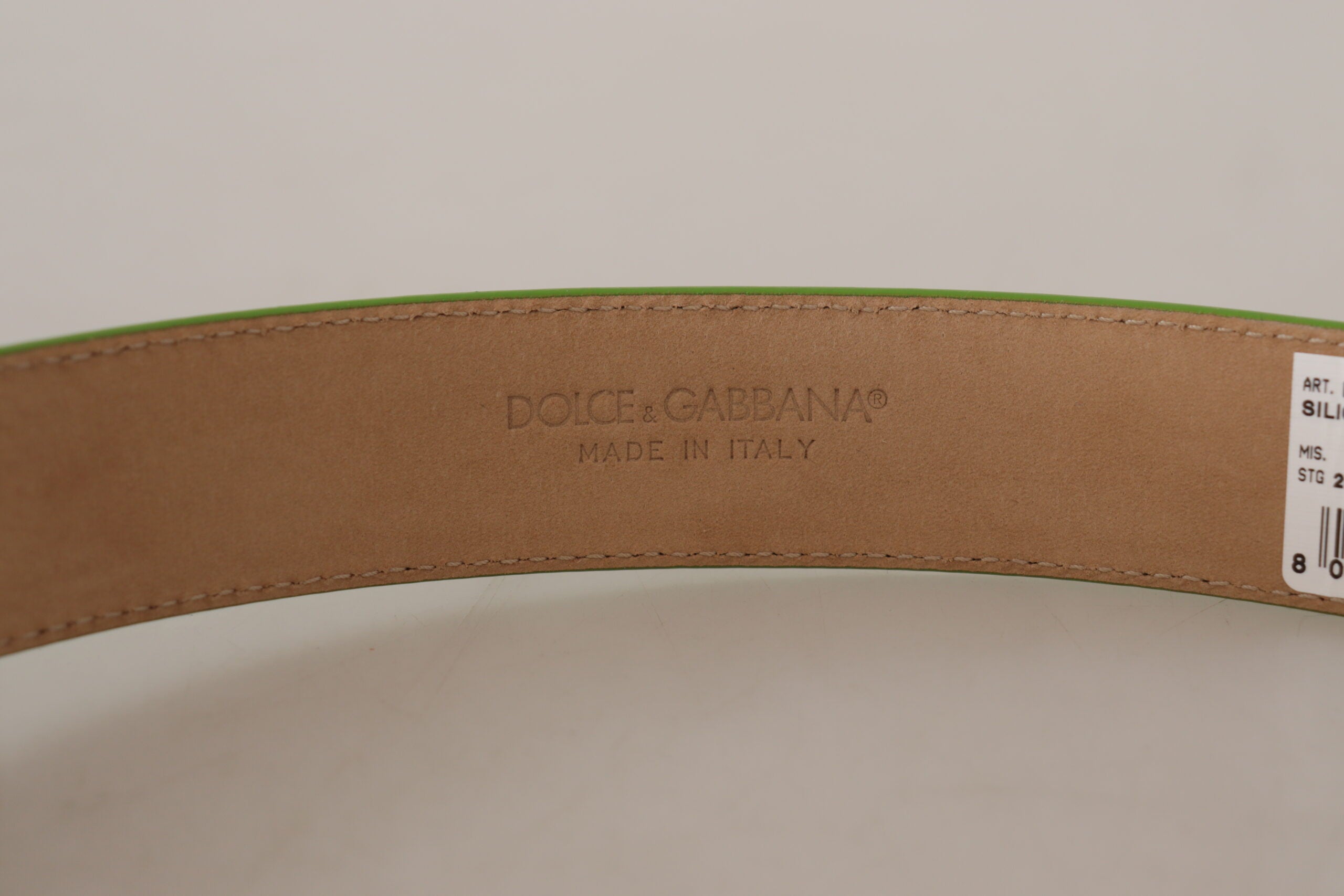 Green leather Devotion Heart micro bag with headphones and belt from Dolce & Gabbana, featuring a compact, stylish design.