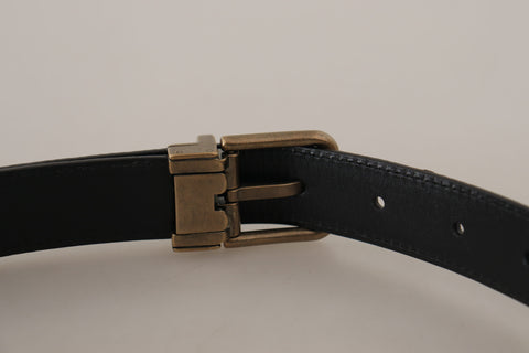 Brown leather belt with leopard print and bronze metal buckle by Dolce & Gabbana, featuring a stylish and luxurious design.