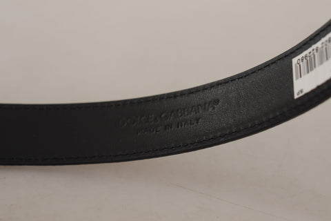 Brown leather belt with leopard print, bronze metal buckle, Dolce & Gabbana fashion accessory, stylish and luxurious.