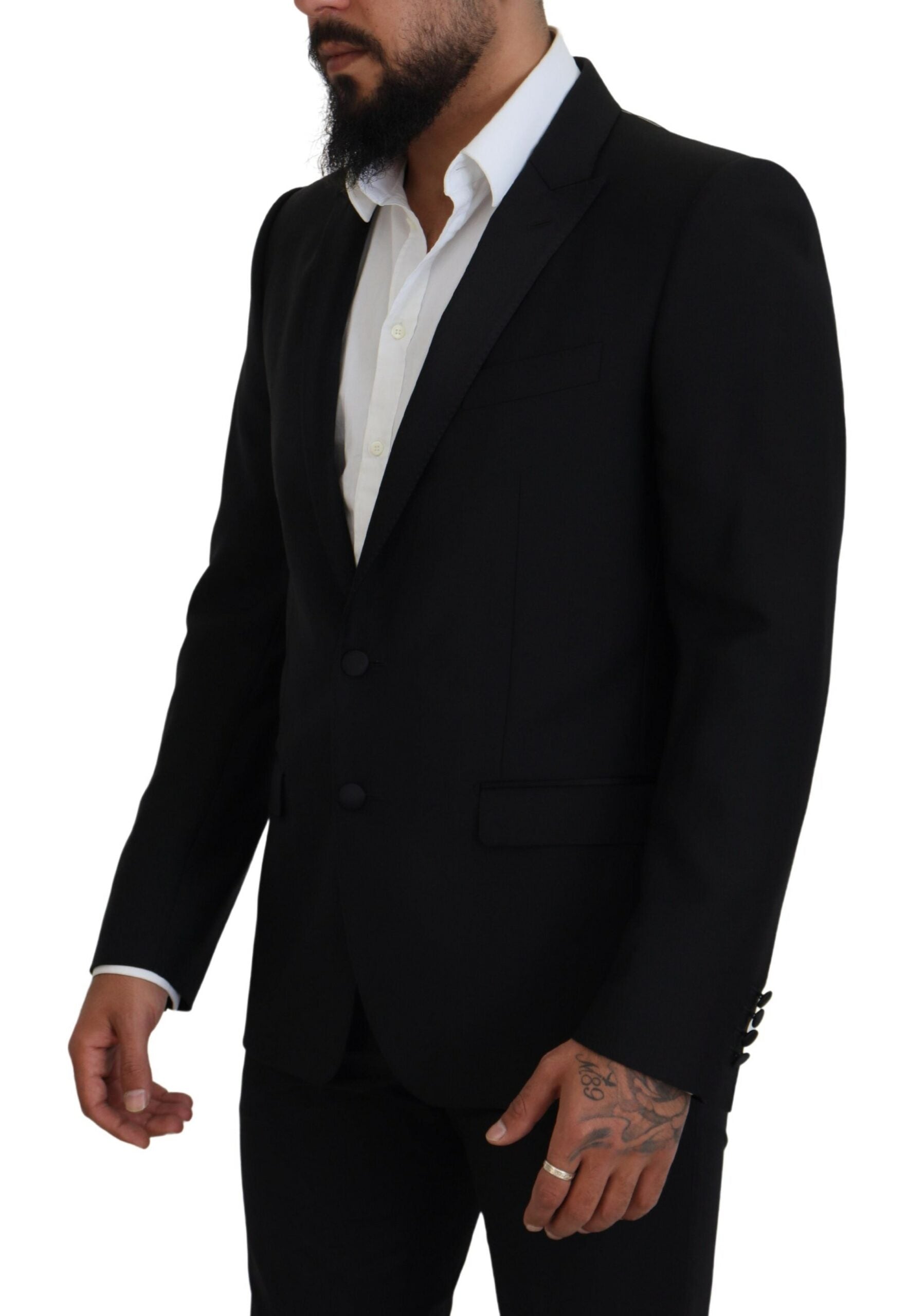 Black slim fit formal martini blazer by Dolce & Gabbana, tailored with sleek lapels and modern fit, displayed on a hanger.