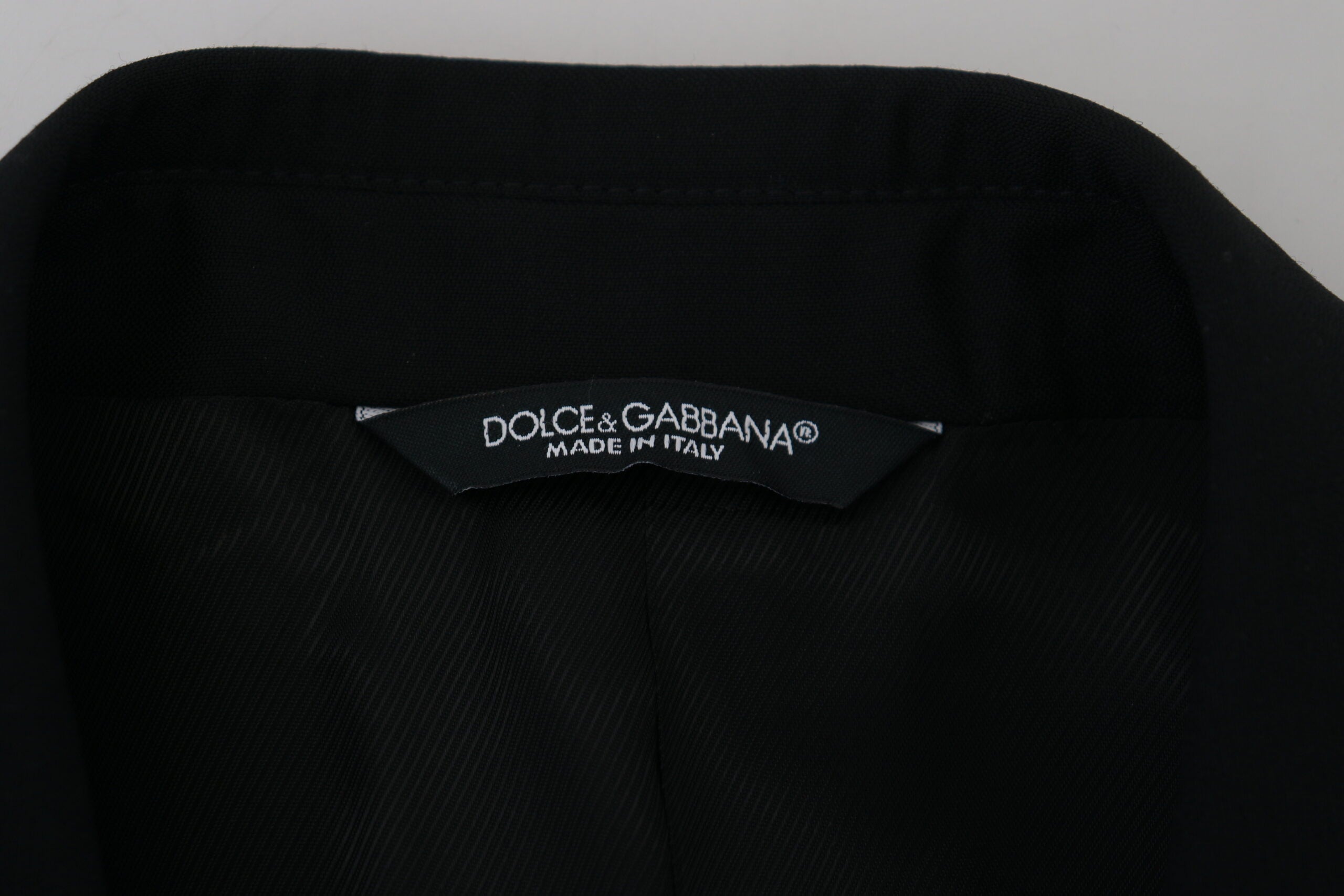 Black slim fit formal blazer by Dolce & Gabbana, tailored fit with classic lapels and sleek design, suitable for elegant occasions.