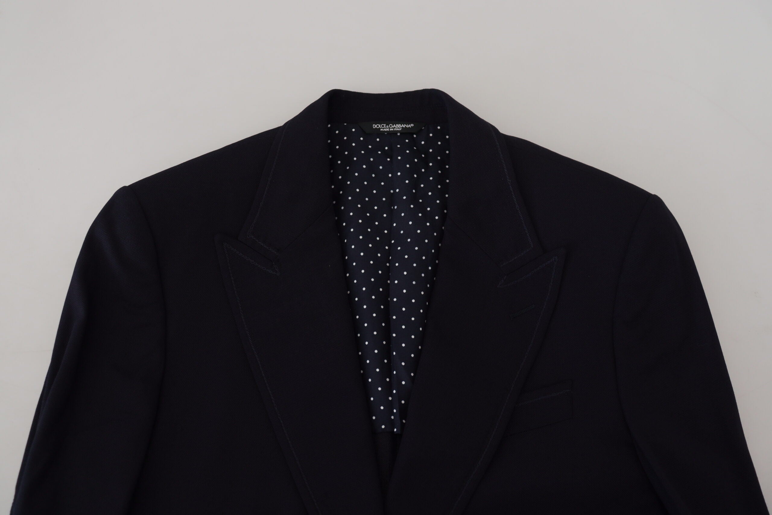 Blue wool formal Taormina blazer by Dolce & Gabbana, tailored fit with classic lapel, displayed on a hanger.