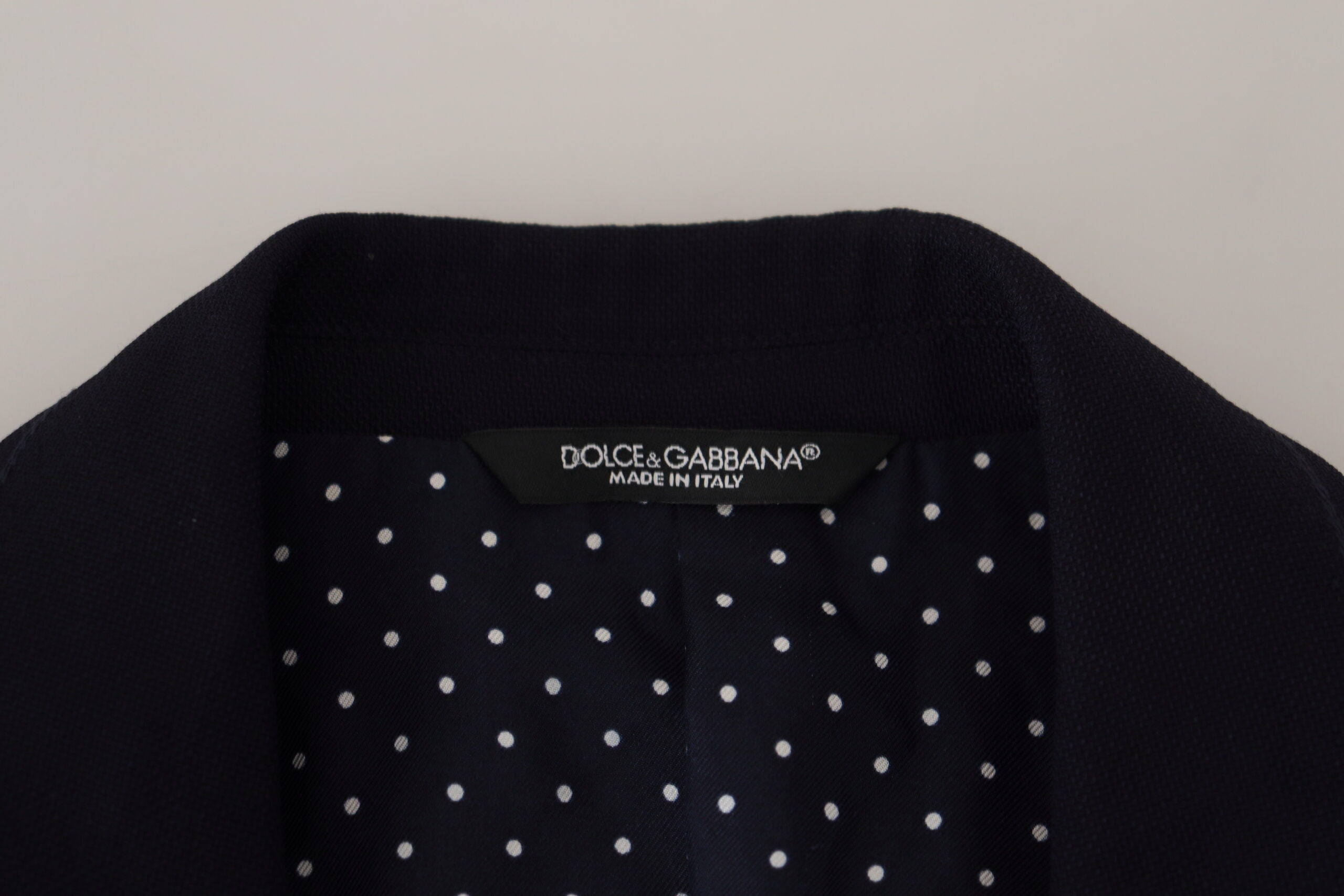 Blue wool formal blazer by Dolce & Gabbana featuring a tailored fit and classic lapel, displayed on a hanger.