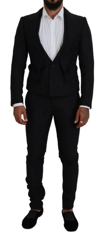 Black polyester men's two-piece Martini suit by Dolce & Gabbana, showing the tailored jacket and matching trousers.