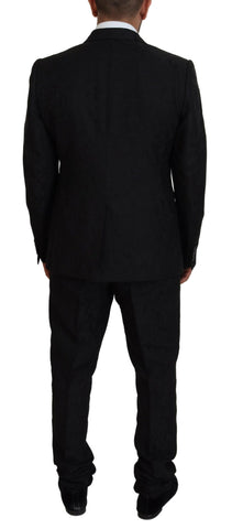 Black single-breasted 2-piece Martini suit by Dolce & Gabbana, featuring classic lapels and tailored fit on a mannequin.