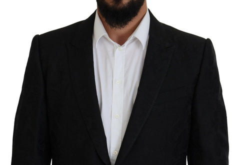 Black single-breasted two-piece Martini suit by Dolce & Gabbana, featuring tailored lapels and classic fit, displayed on a mannequin.
