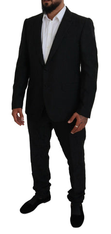 Black single-breasted 2-piece Martini suit by Dolce & Gabbana, shown on a mannequin with tailored fit and classic lapel design.