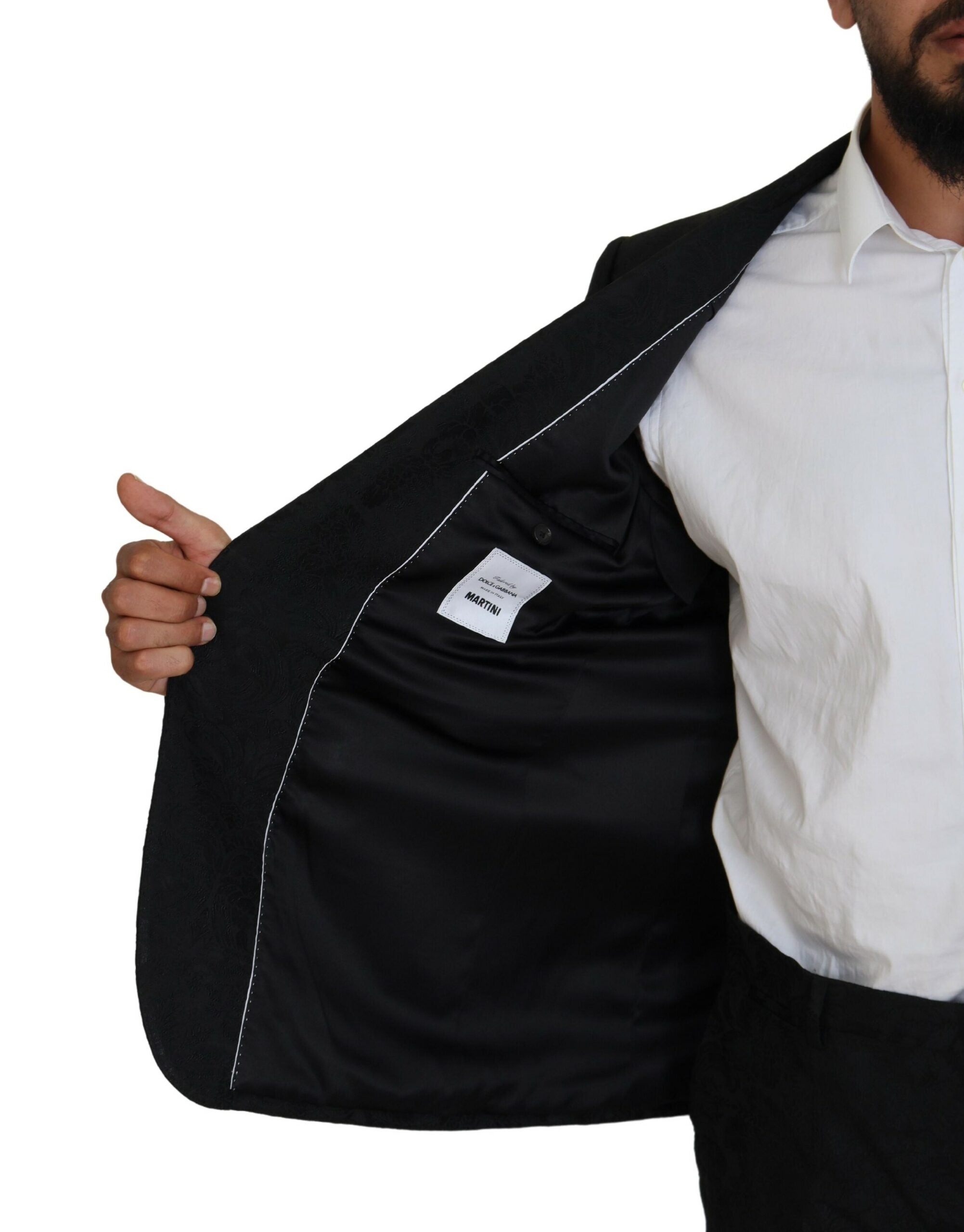 Black single-breasted 2-piece Martini suit by Dolce & Gabbana, shown on a model with tailored fit and classic lapel design.