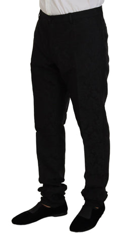 Black single-breasted 2-piece Martini suit by Dolce & Gabbana, featuring tailored lapels and classic fit on a mannequin.