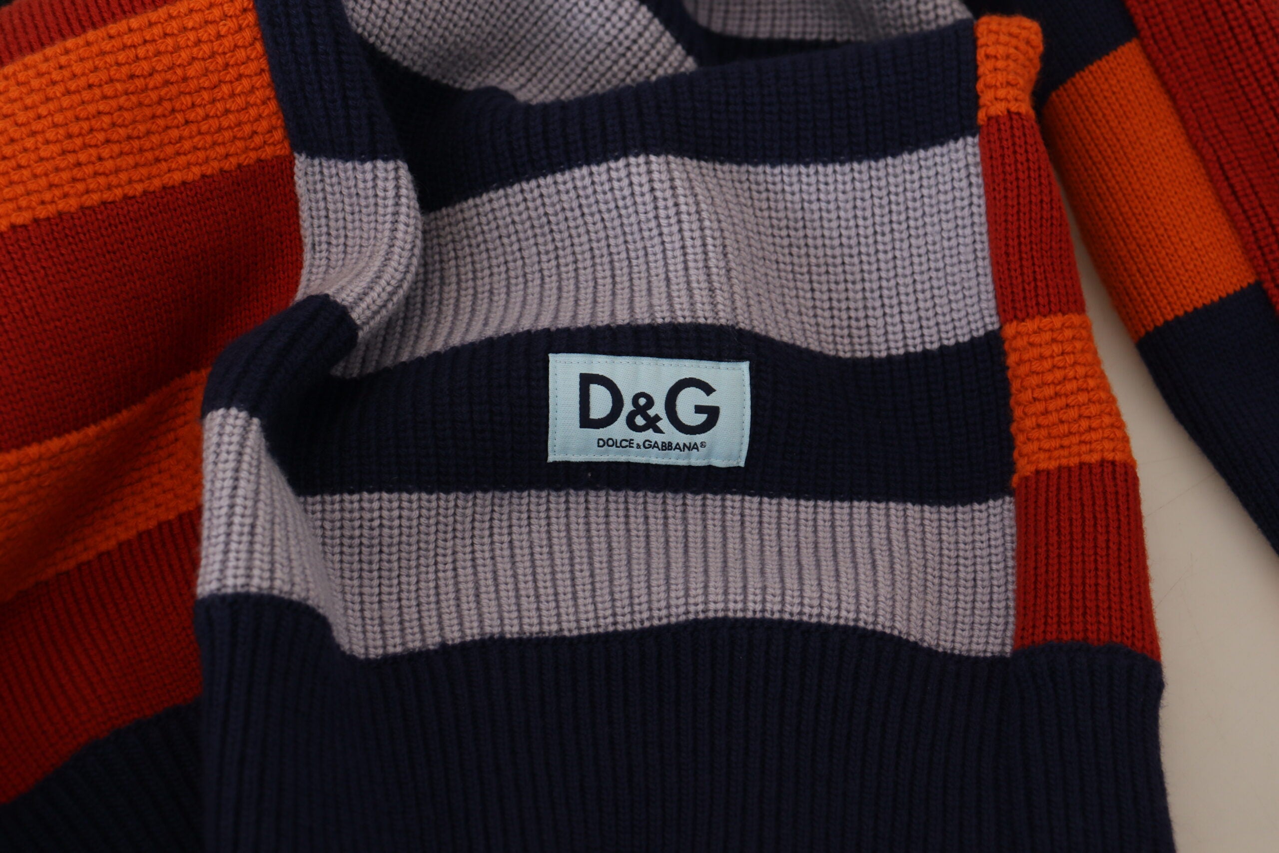 Multicolor striped wool pullover sweater by Dolce & Gabbana, featuring vibrant horizontal stripe pattern and cozy knit texture.