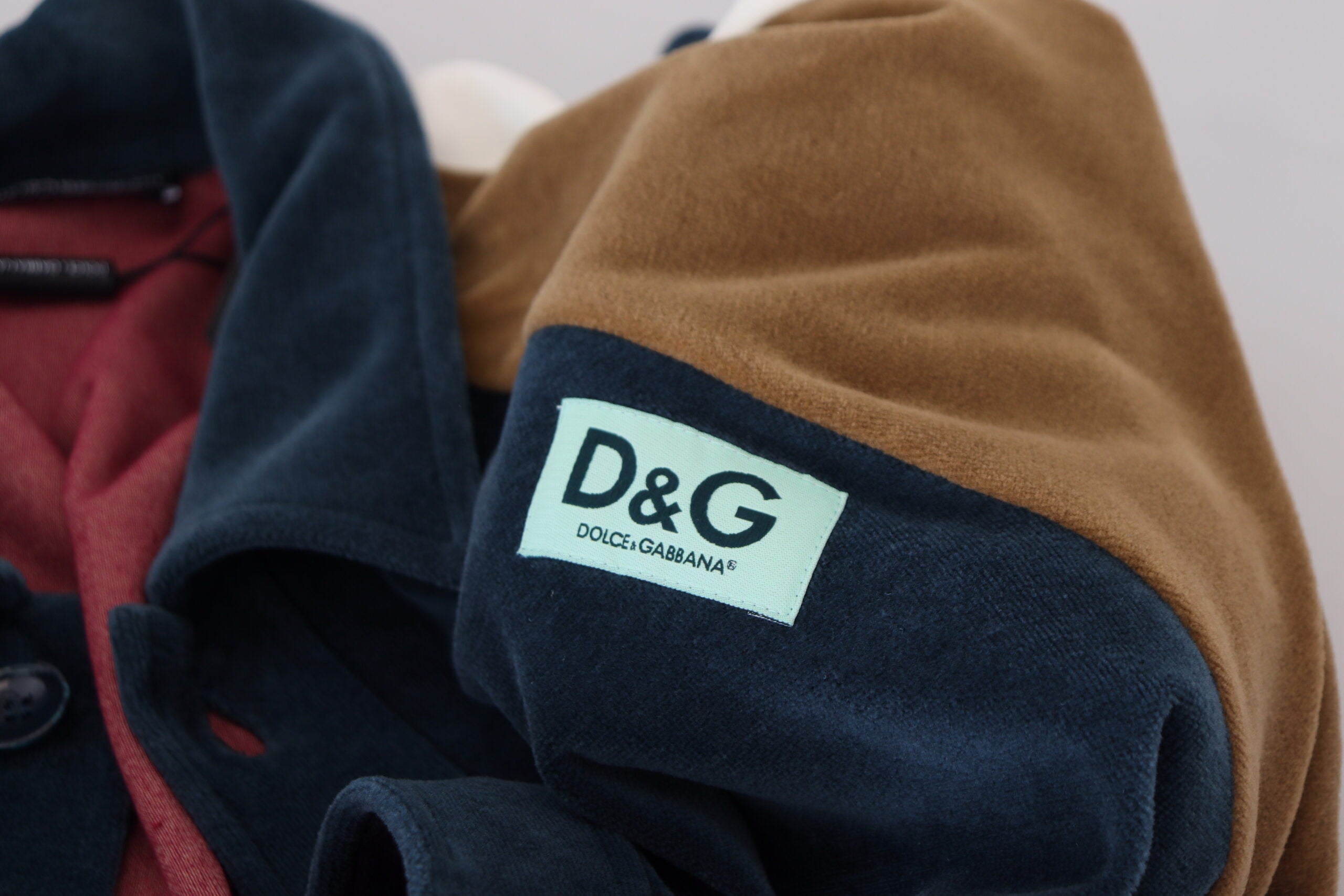 Multicolor cotton collared pullover sweater by Dolce & Gabbana, featuring a vibrant striped design and ribbed cuffs.