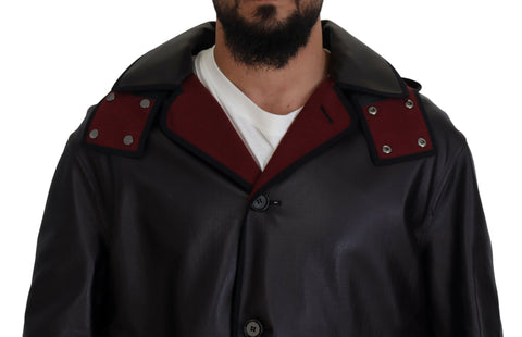 Black Dolce & Gabbana hooded trench parka made of cotton, featuring a classic design and functional hood for stylish weather protection.