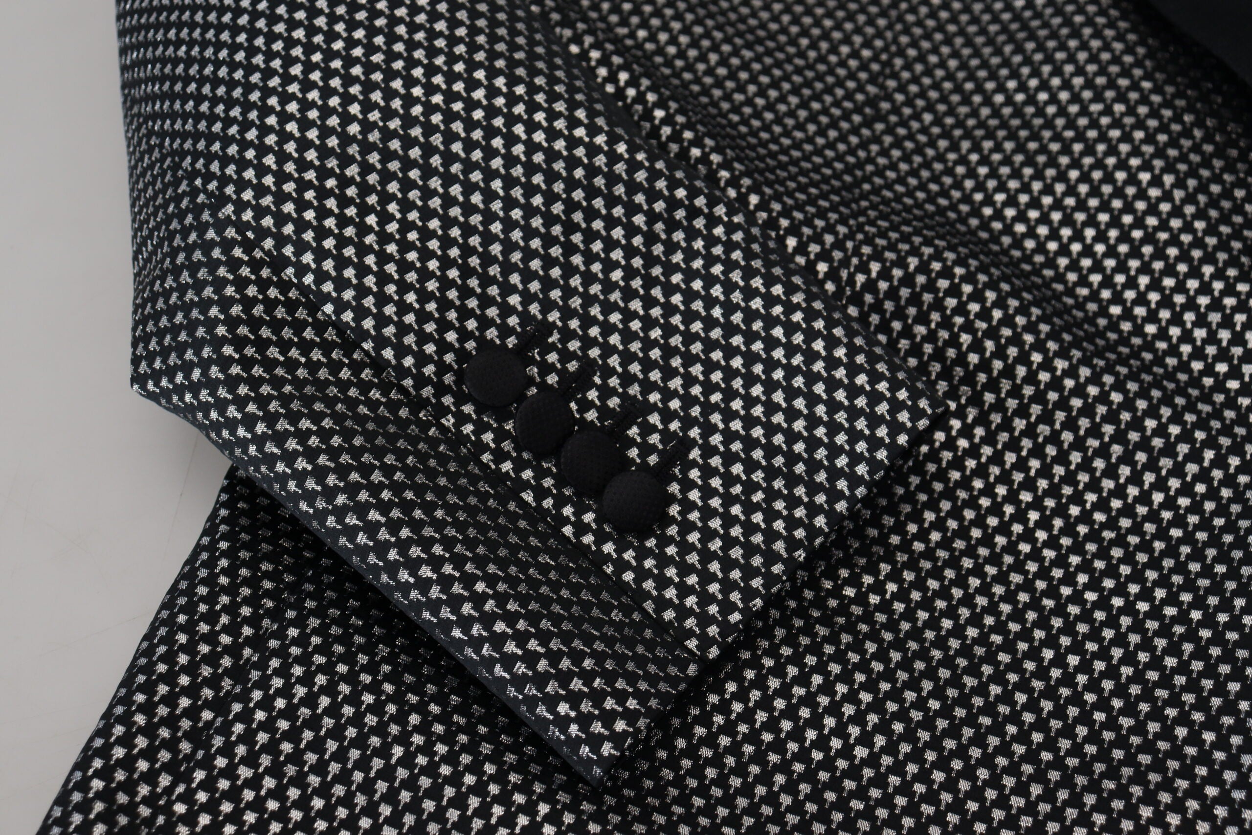 Black and silver jacquard slim fit blazer jacket by Dolce & Gabbana, featuring intricate woven pattern and tailored fit.