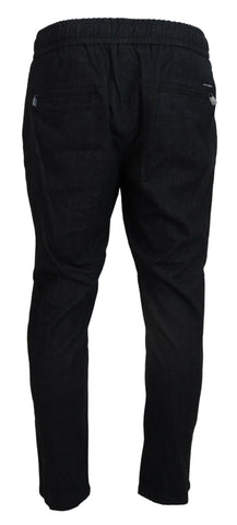 Gray cotton tapered pants by Dolce & Gabbana, featuring a relaxed fit and classic design, shown on a model.