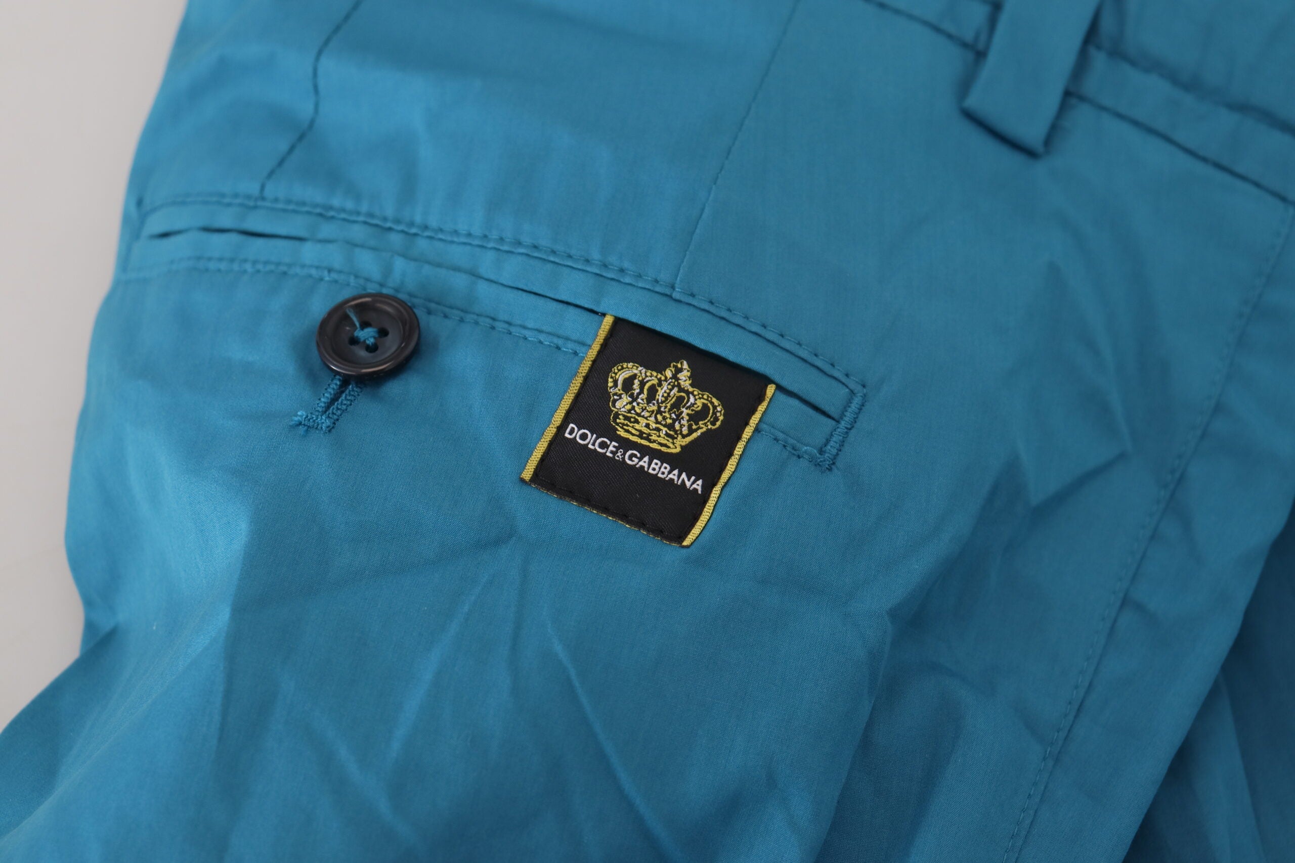 Blue cotton chinos trousers from Dolce & Gabbana, showing a slim-fit design with front and back pockets.