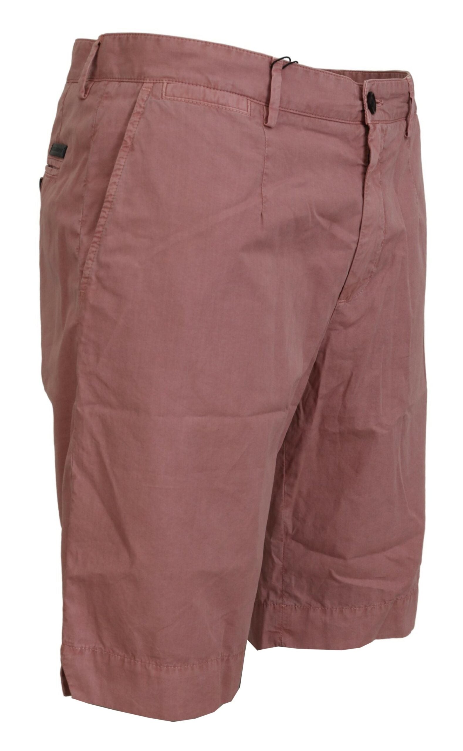 Pink cotton casual men's chinos shorts with a relaxed fit, branded by Dolce & Gabbana, shown in a natural outdoor setting.