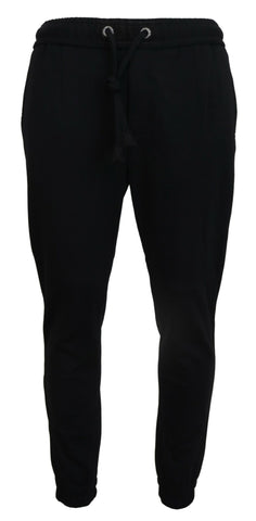 Black men's sport wool sweatpants by Dolce & Gabbana, casual athletic pants with a relaxed fit and elastic waistband.