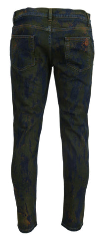 Blue and green skinny cotton denim jeans by Dolce & Gabbana, close-up of fitted style and detailed stitching.