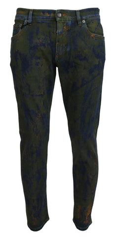 Blue and green skinny cotton denim jeans by Dolce & Gabbana, close-up of the fitted style and detailed stitching.
