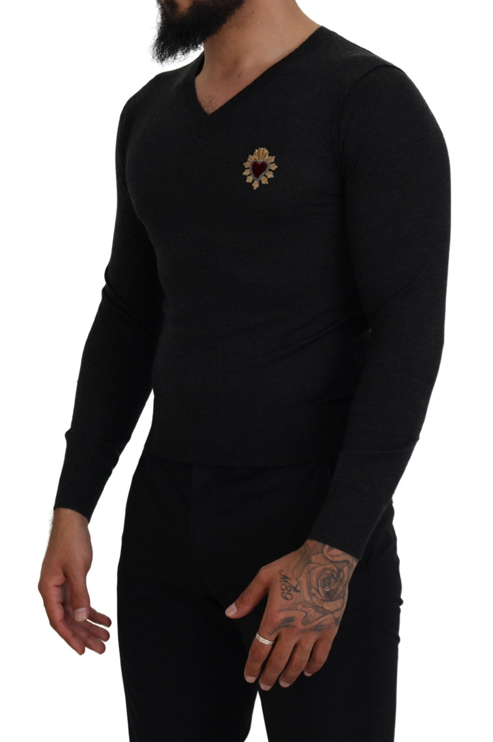 Gray cashmere V-neck sweater with gold heart detail by Dolce & Gabbana, showcasing the soft fabric and elegant design.