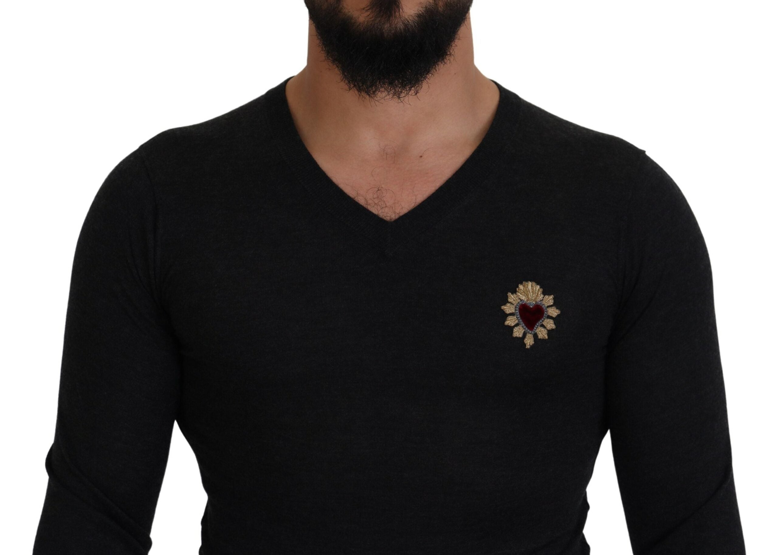 Gray cashmere V-neck sweater by Dolce & Gabbana with gold heart detail, soft knit fabric, and classic fit.