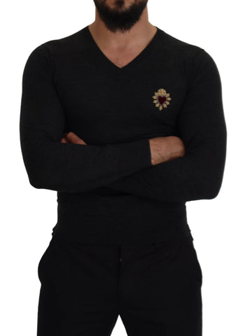 Gray cashmere V-neck sweater with gold heart detail by Dolce & Gabbana, shown on a mannequin.