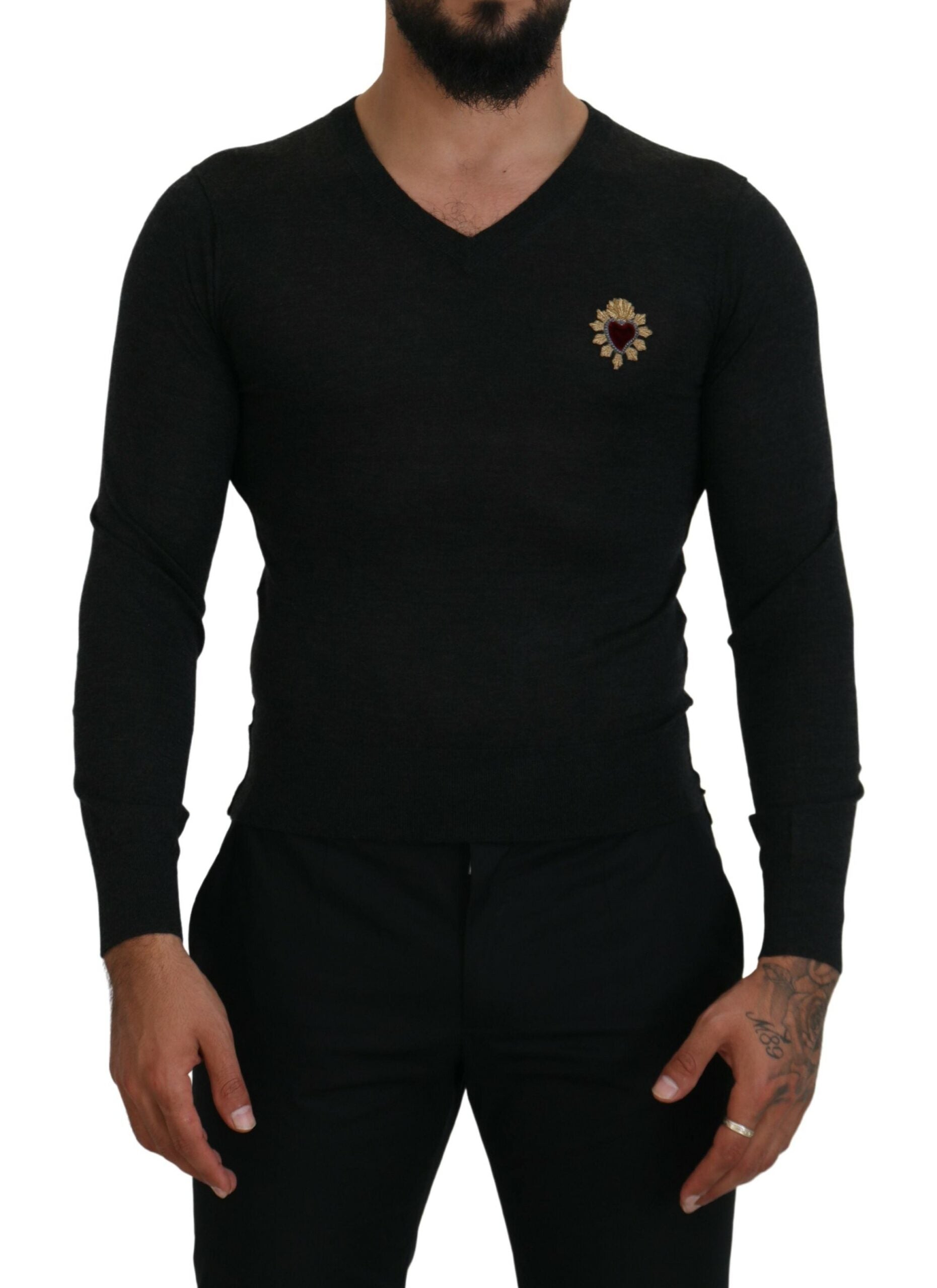 Gray cashmere V-neck sweater with gold heart detail by Dolce & Gabbana, showcasing the soft fabric and stylish design.