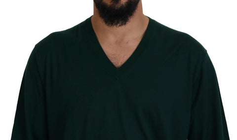 Green Dolce & Gabbana cashmere V-neck pullover sweater displayed on a hanger. Soft texture and classic fit.