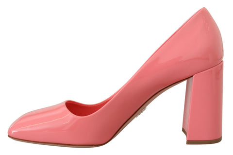 Prada pink patent leather block heels pumps showing a classic high-heeled shoe with a glossy finish and elegant design.
