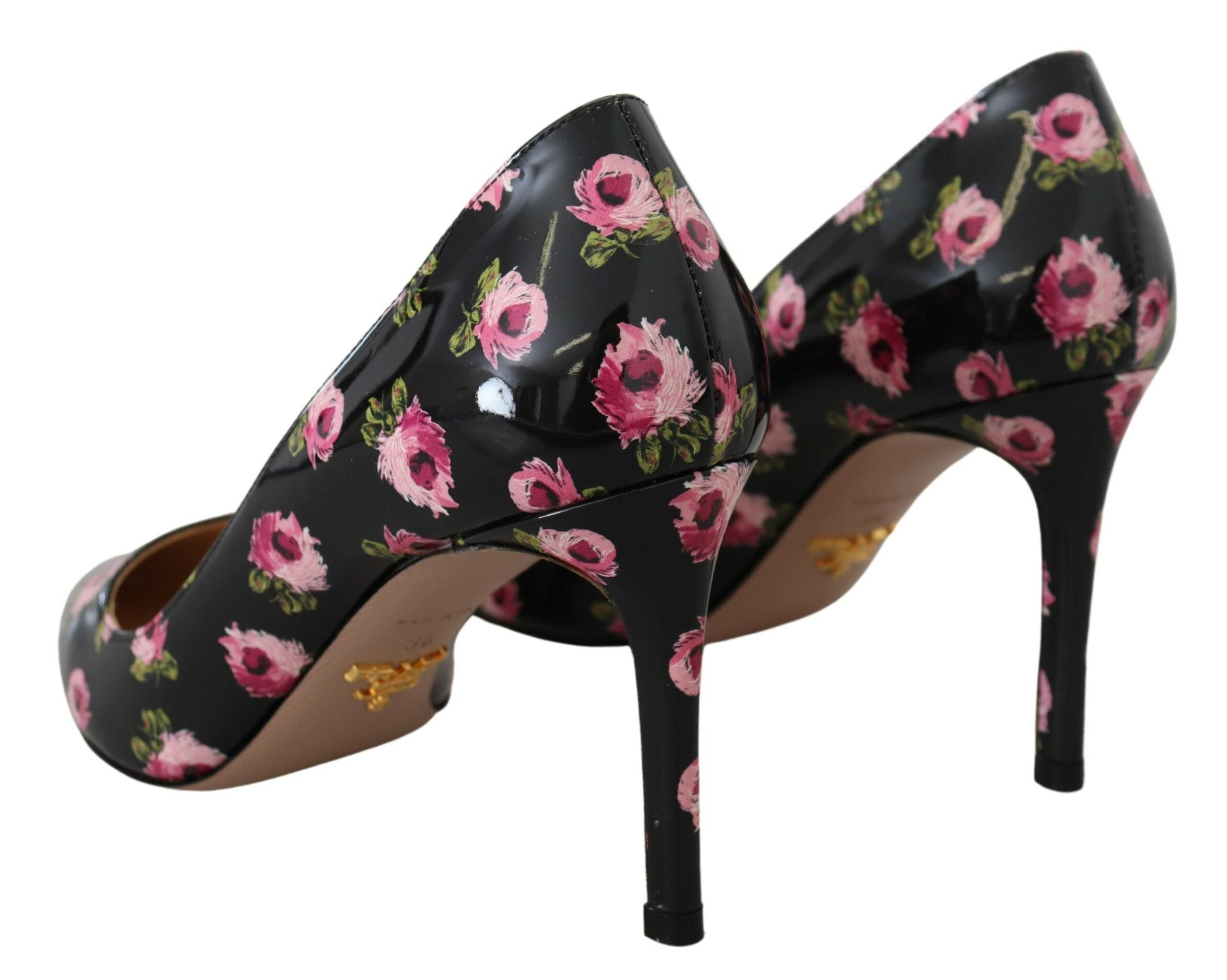 Black leather floral stilettos by Prada featuring elegant high heels and intricate floral detailing on the pumps.
