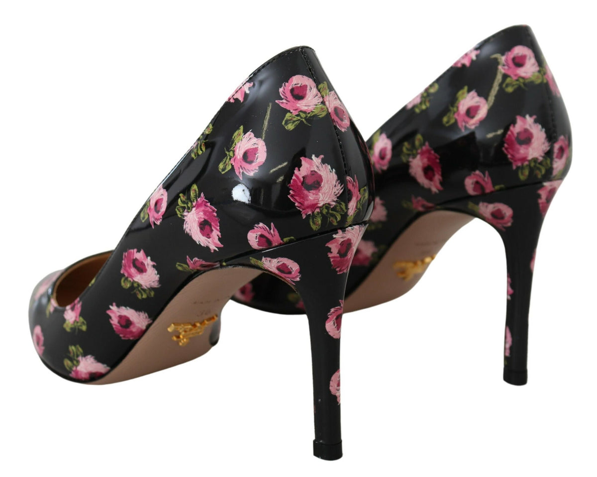 Black leather floral stilettos by Prada featuring elegant high heels and intricate floral detailing on the pumps.