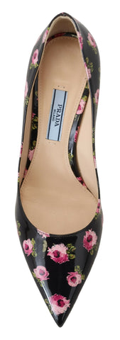 Black leather floral stilettos pumps by Prada featuring elegant design and pointed heels.