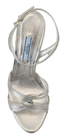 Prada silver leather ankle strap stiletto heels with open toe and sleek design, perfect for elegant summer footwear.