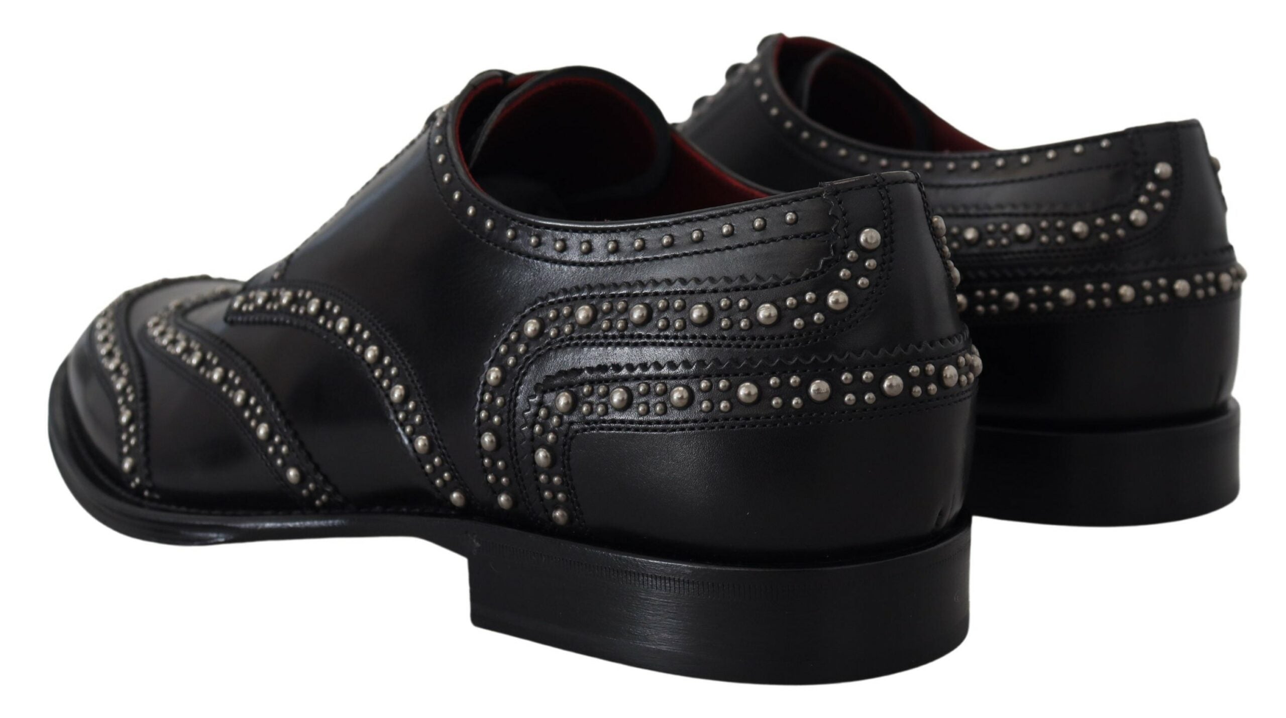 Black leather Derby dress shoes with studded accents by Dolce & Gabbana, featuring a polished finish and classic lace-up design.