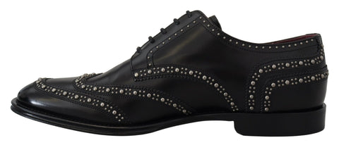 Black leather Derby dress shoes with studded details from Dolce & Gabbana, featuring a classic lace-up design and sleek finish.