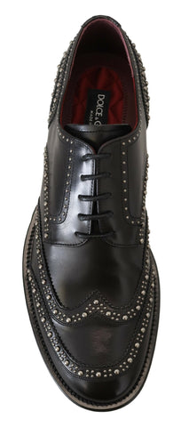 Black leather Derby dress shoes with studded details by Dolce & Gabbana, featuring a sleek and polished design.