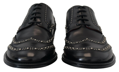 Black leather Derby dress shoes with studded accents by Dolce & Gabbana, featuring sleek design and polished finish.