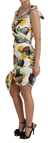 White coconut print silk sheath mini dress by Dolce & Gabbana, featuring a fitted silhouette and vibrant tropical pattern.